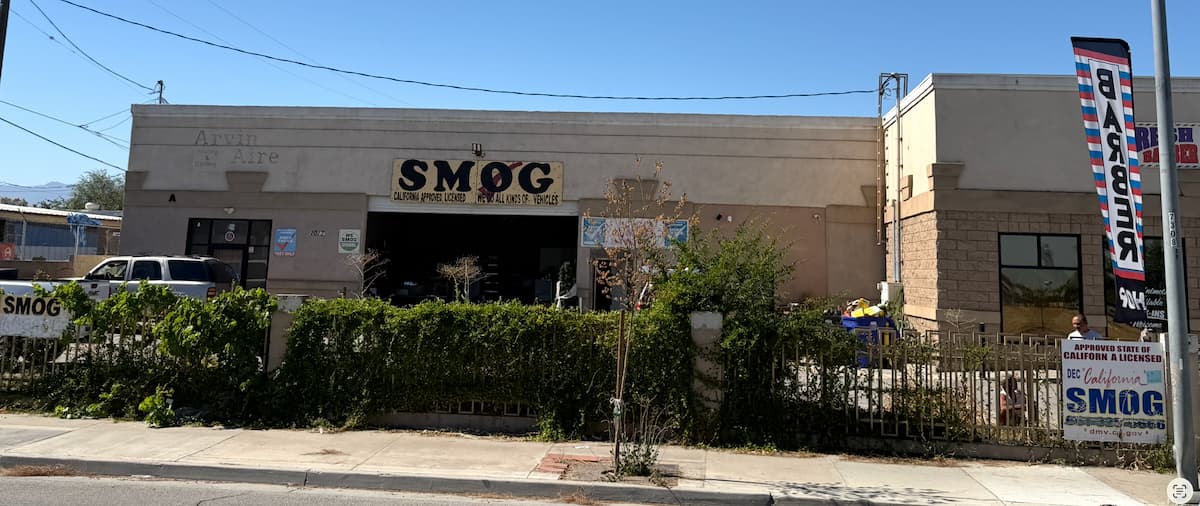 Star Smog inspection bay in Arvin, CA with a technician performing a smog check